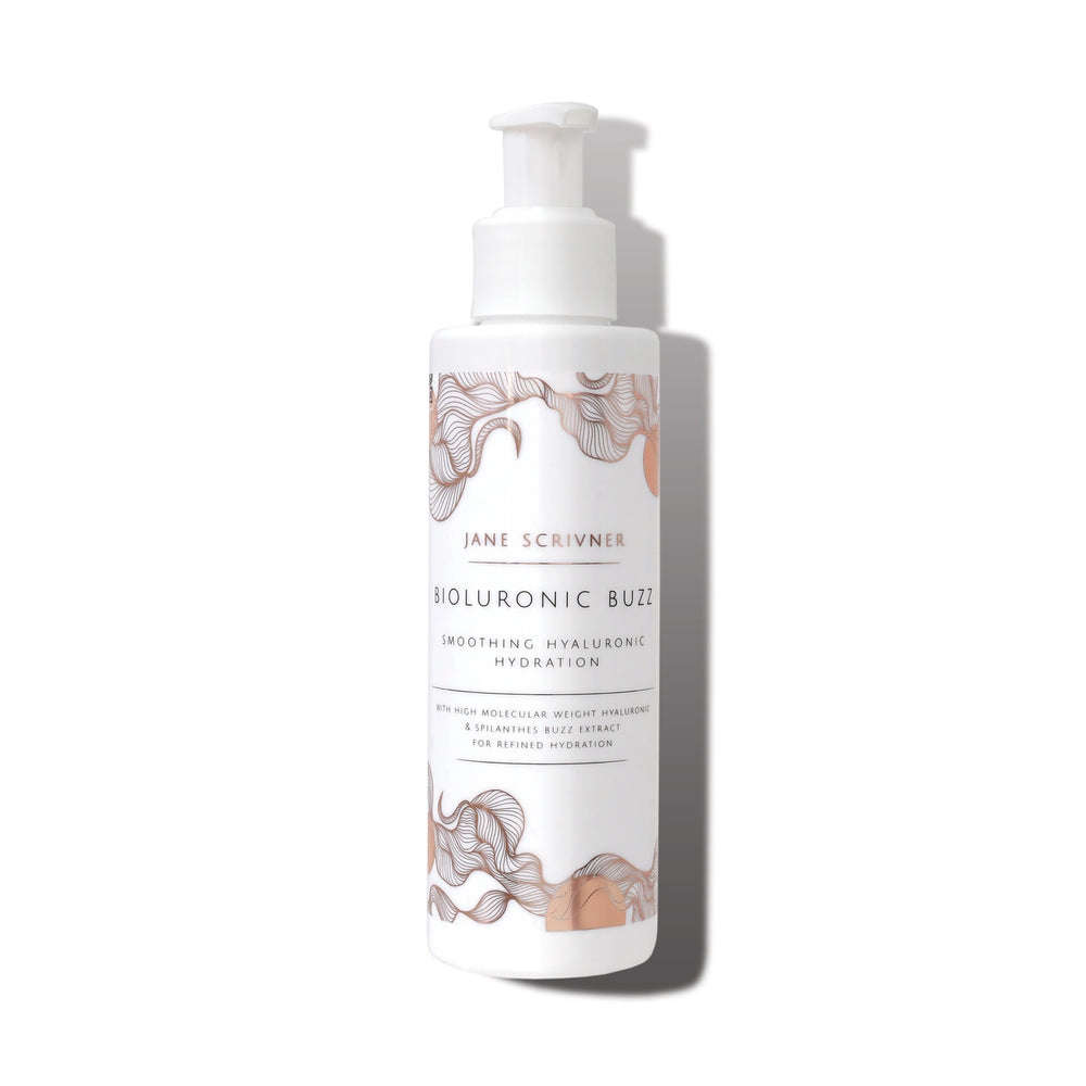 A white pump bottle of Jane Scrivner Bioluronic Blioz Smoothing Hyaluronic Serum, featuring elegant beige and brown abstract floral illustrations on the label, set against a clean white background with a soft shadow.