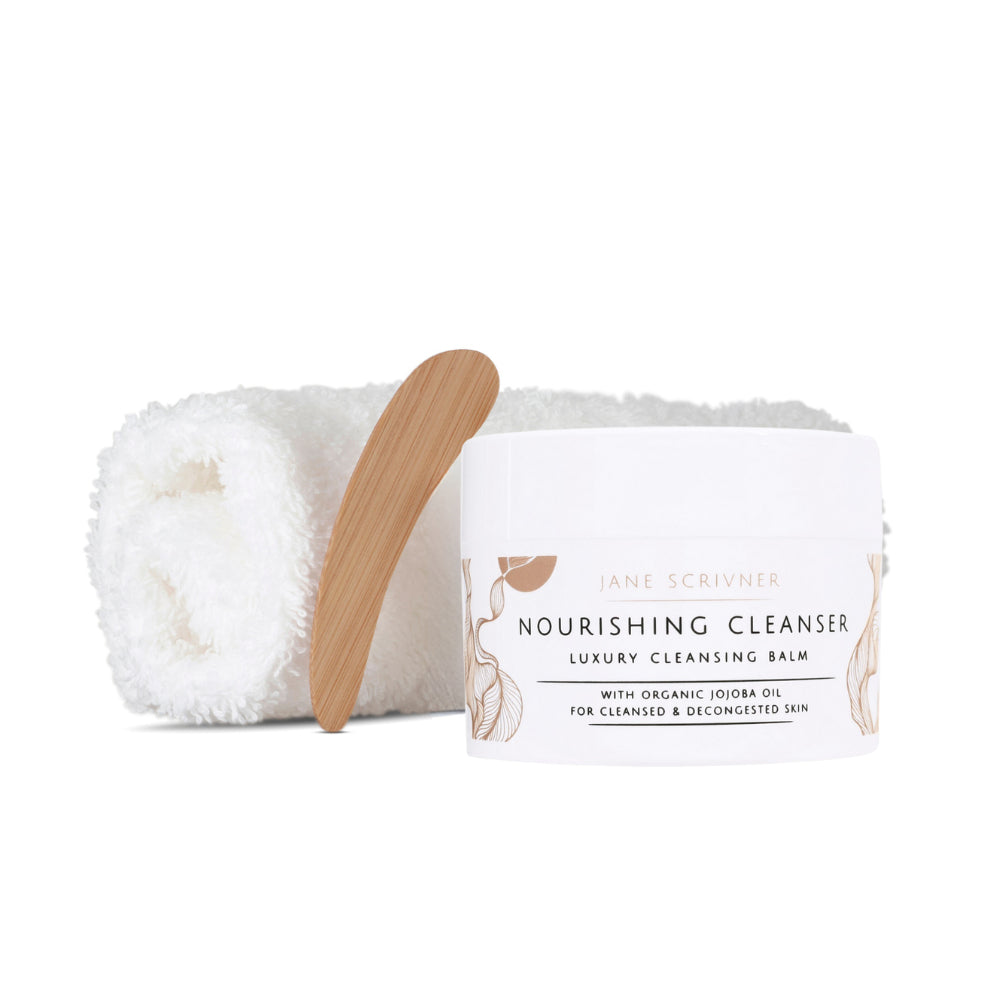 A white cosmetic jar of Jane Scrivner Nourishing Cleanser Luxury Cleansing Balm with gold botanical illustrations and black text, set against a clean white background with a soft shadow.