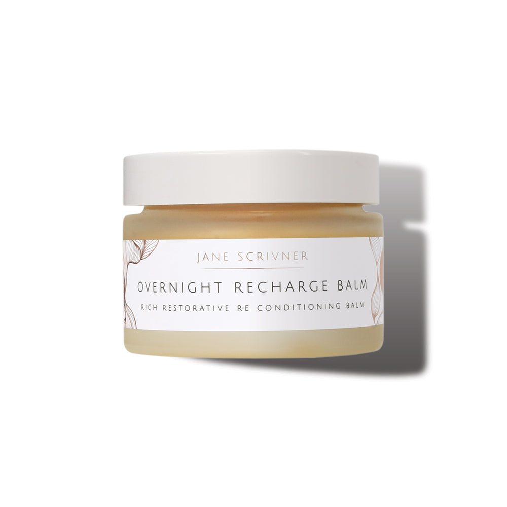 Jane Scrivner Overnight Recharge Balm in a clear jar showing the beige balm inside, with a white lid and label, set against a white background with a soft shadow.