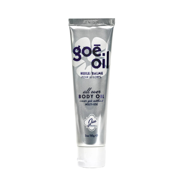 Silver tube of goé oil on a white background