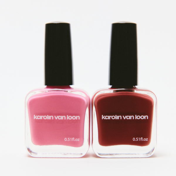 Two bottles of Karolin van Loon nail polish, one pink and one red, on a white background.