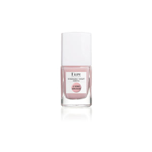 Kure Bazaar Colored Nail Hardener in Pink, providing a strengthening, brightening, and nourishing effect for nails with a glossy, durable finish.