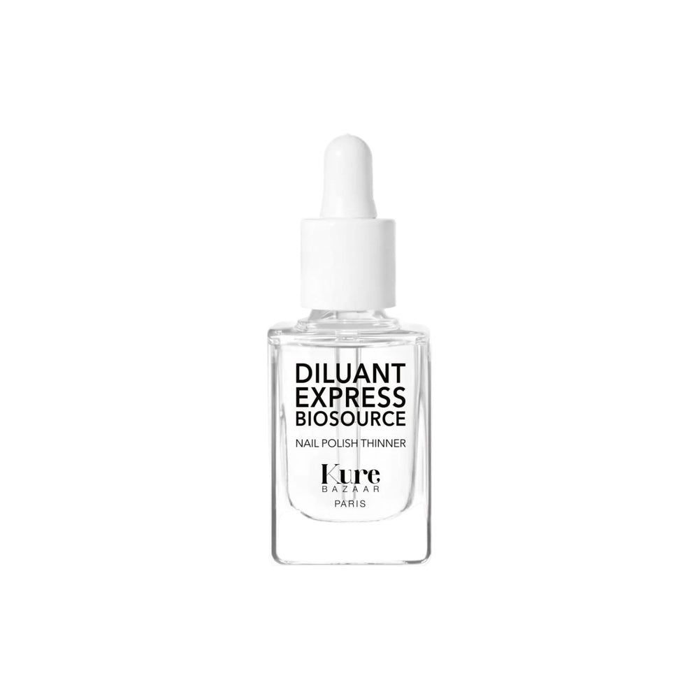 A clear glass dropper bottle of Kure Bazaar Diluant Express Biosource Nail Polish Thinner with a white dropper cap and black text, centered on a solid white background.
