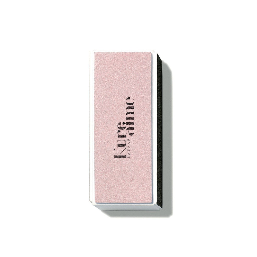 Kure Bazaar Pink Buffing Block nail accessory with multiple sides for polishing and a white side for high-shine finish.