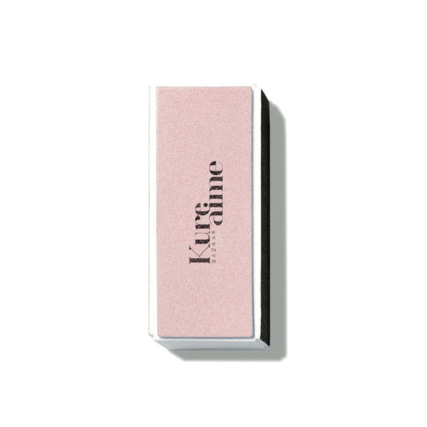 Kure Bazaar Pink Buffing Block nail accessory with multiple sides for polishing and a white side for high-shine finish.