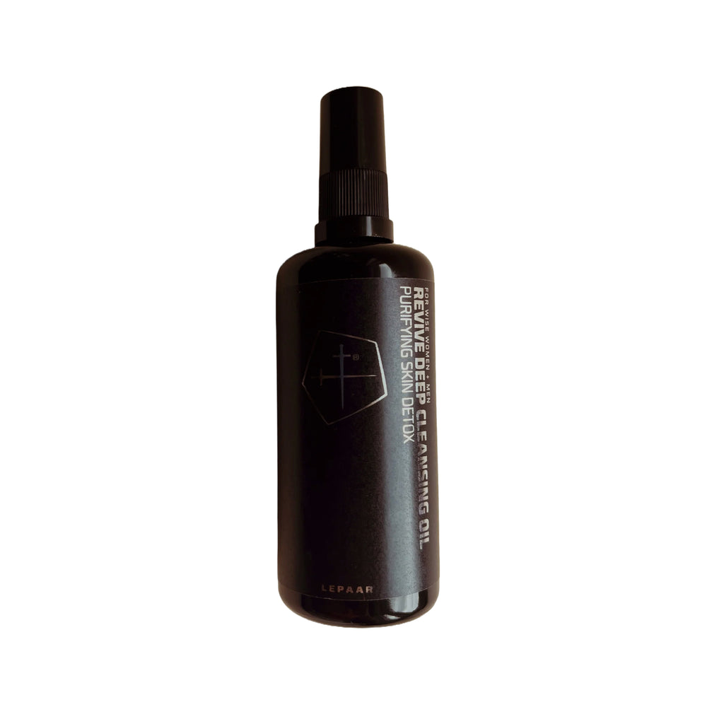 Bottle of Lepaar Revive Deep Cleansing Oil in matte black Miron glass with pump dispenser, set against a clean white background—highlighting the sleek minimalist design, subtle logo, and rich amber liquid inside. 
