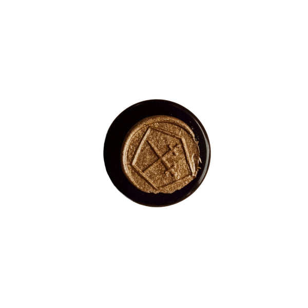 LEPAAR Velvet Sole Lip + Face Balm in glass jar with golden balm, a nourishing balm for dry lips and delicate facial skin, enriched with botanicals and 24k gold.