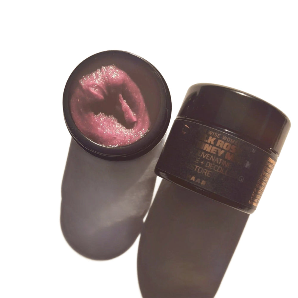 Black glass jar with a sleek minimalist design containing LEPAAR Silk Rose Honey Mask. The jar features a subtle gold emblem on the lid, reflecting a luxurious and elegant skincare product.