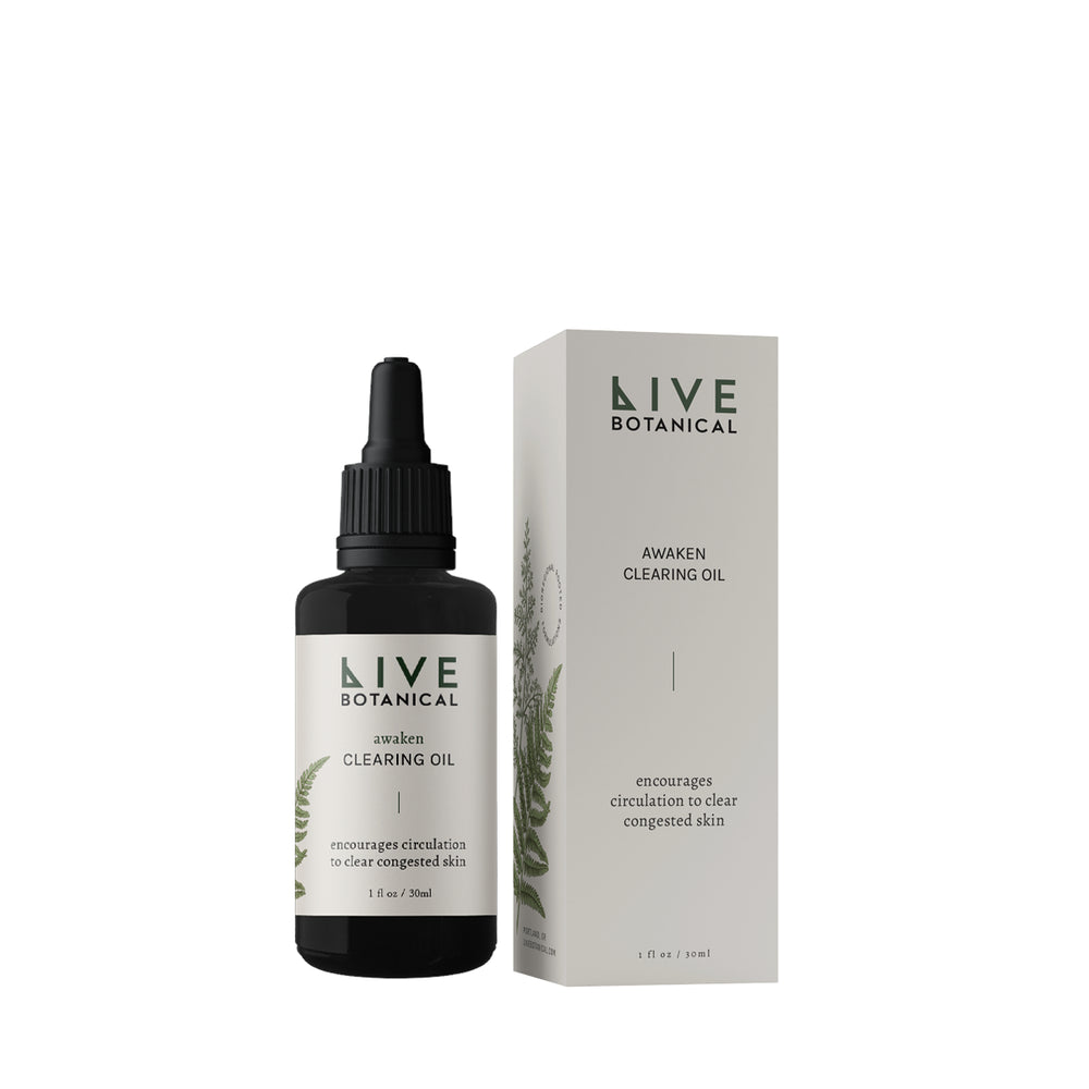 Live Botanical Awaken Clearing Oil in a bottle with a natural, earthy design. A blend of calendula, pumpkin seed, and black caraway seed oils to hydrate and soothe sensitive skin.