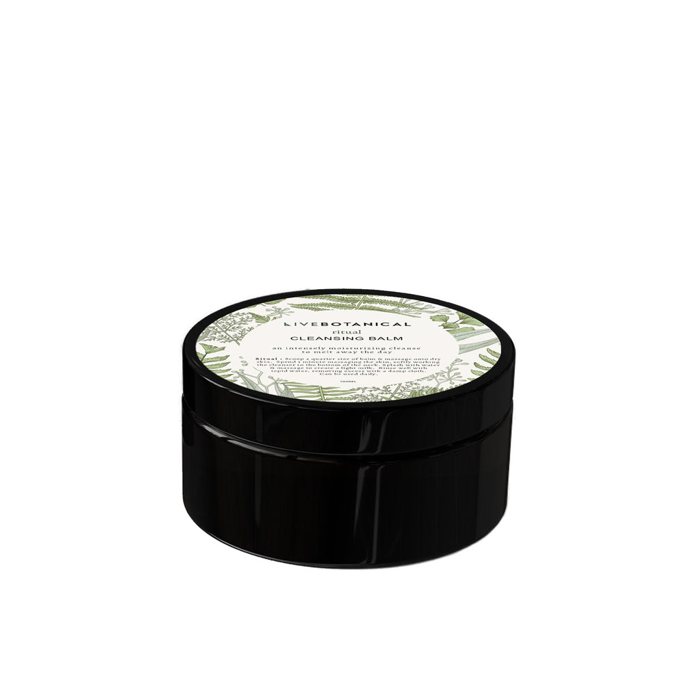 live botanical ritual cleansing balm in black glass jar on white background