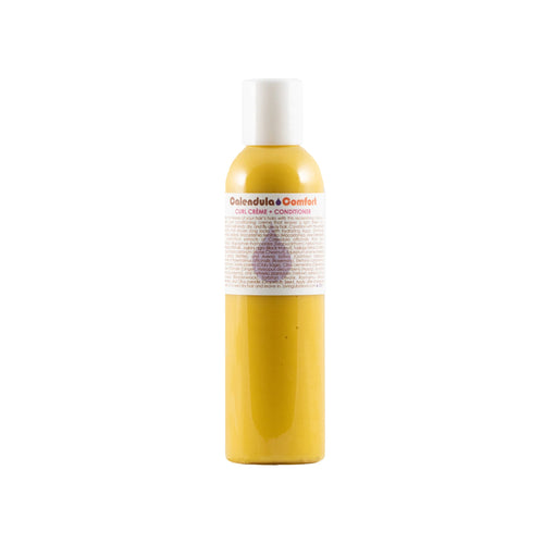 Living Libations Calendula Comfort Curl Crème + Conditioner bottle with botanical ingredients, ideal for soft, manageable curls and frizz-free hair. 120ml