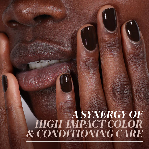 Close-up of a person's face with dark brown nails, with text overlay about high-impact color and conditioning care.
