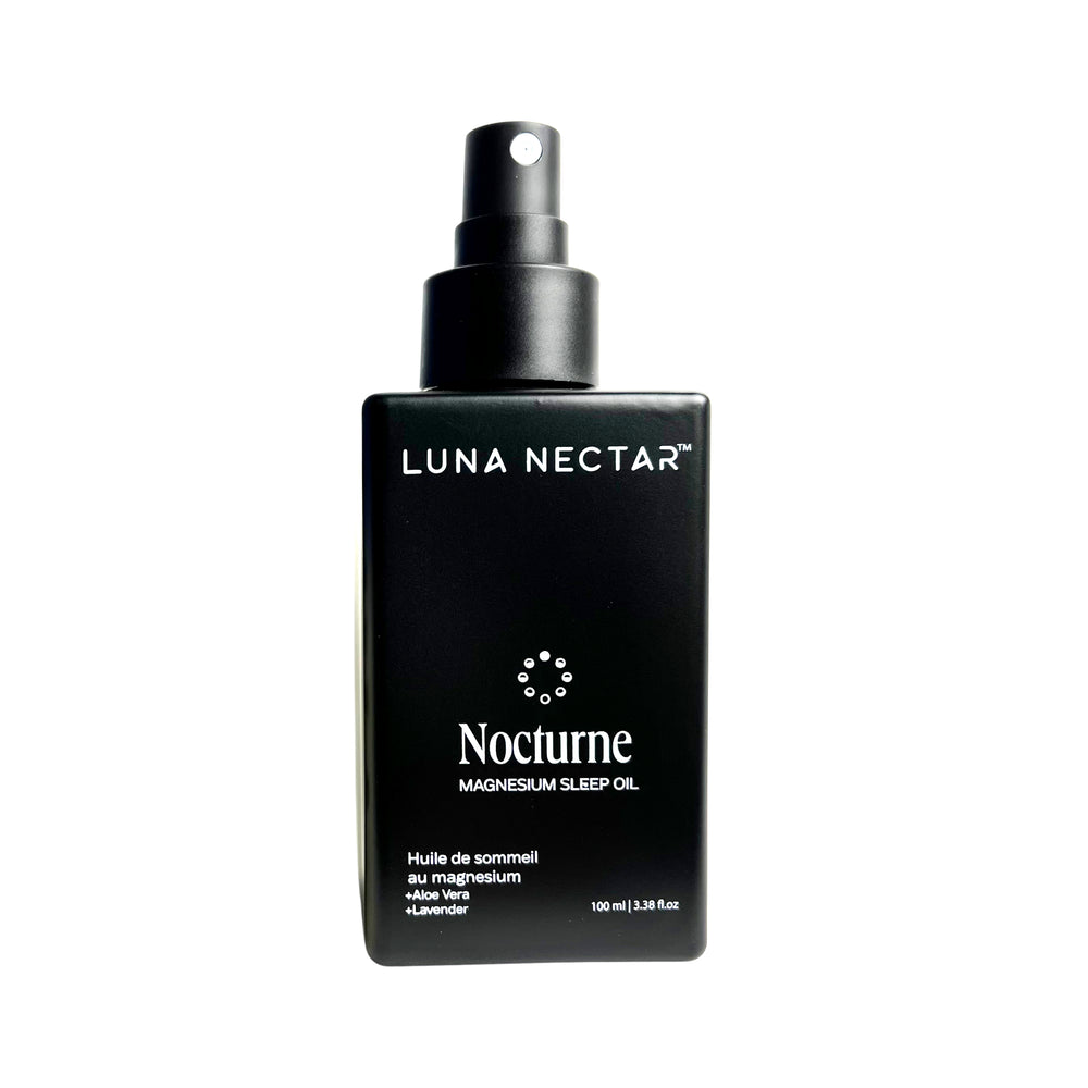 Black bottle of Luna Nectar Nocturne magnesium sleep oil on a white background