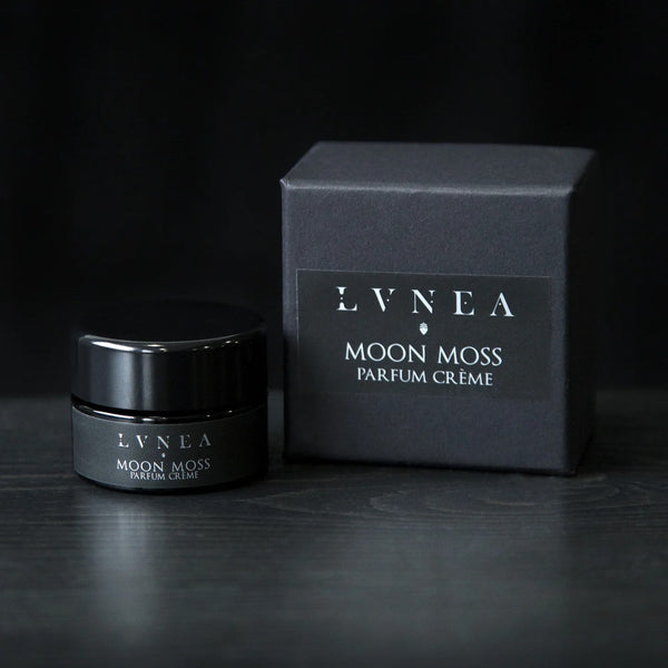 LVNEA Moon Moss Parfum Crème in an amethyst glass pot with a gift box—solid perfume with notes of lavender, oakmoss, and patchouli.