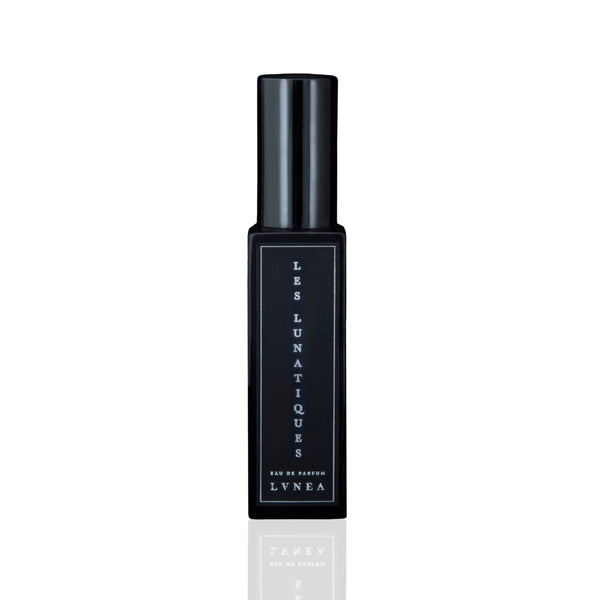LVNEA Les Lunatiques Eau de Parfum in a 30ml black glass bottle. The fragrance features notes of wormwood, copal, musk, and sandalwood, capturing a lunar-inspired blend of creamy, metallic, and resinous elements. 30ml