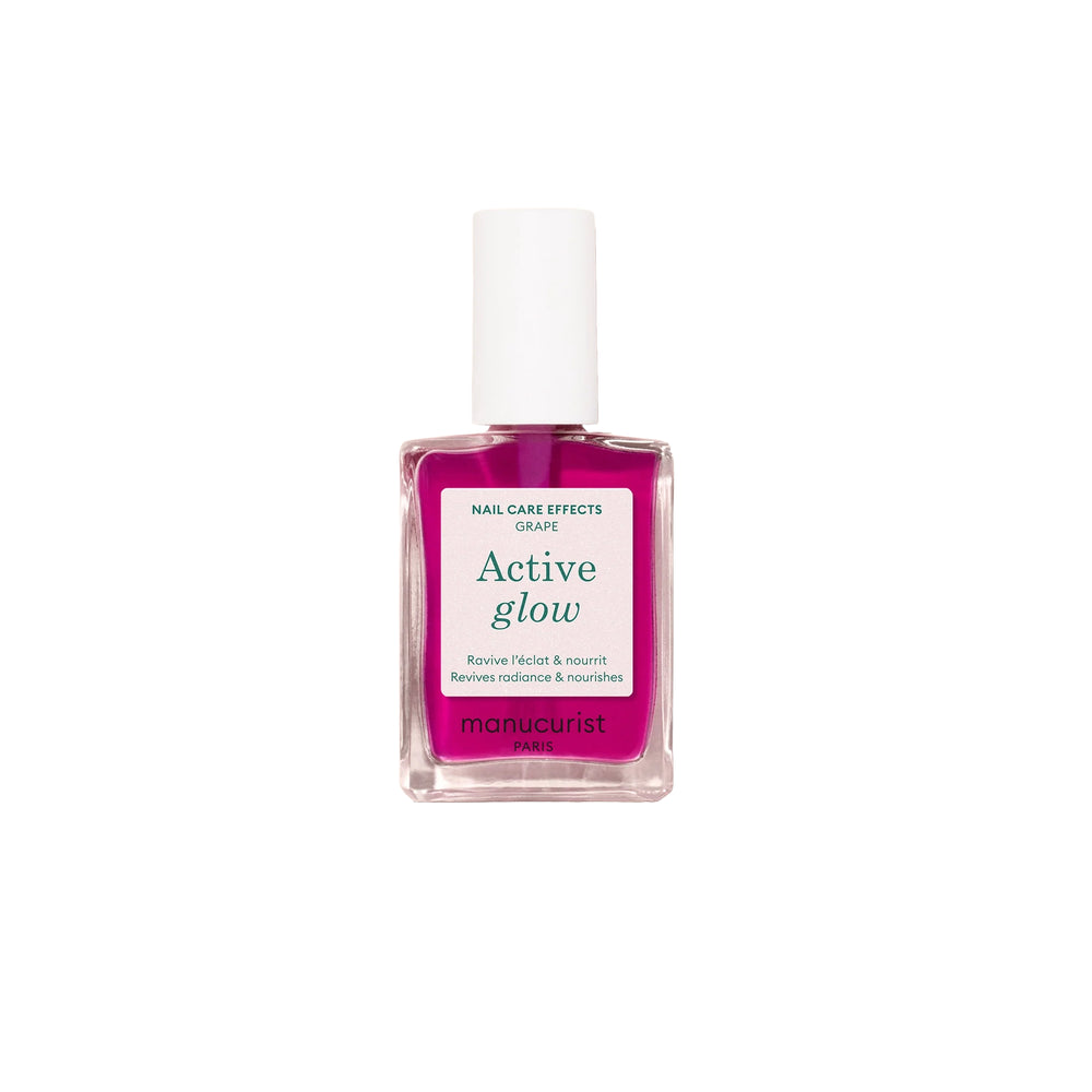 Bottle of MANUCURIST Active Glow™ Grape lilac nail polish with translucent shine and plant-based ingredients.