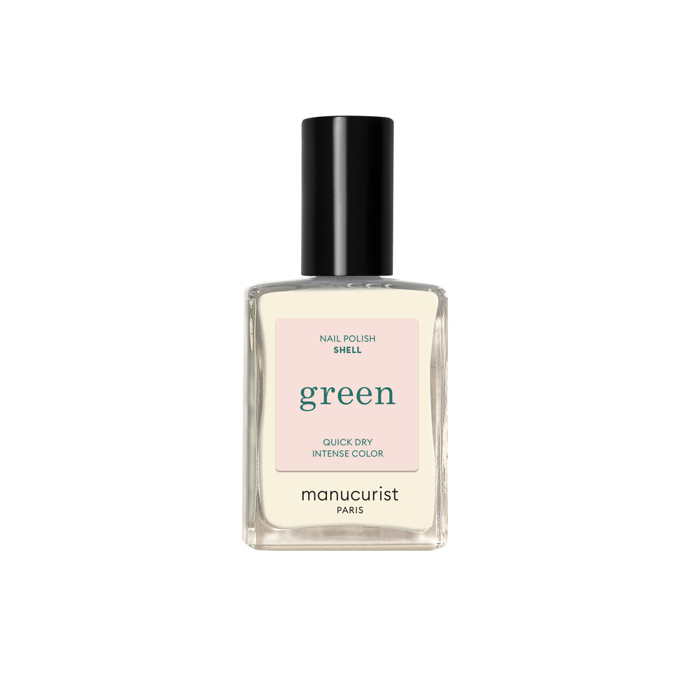 A bottle of Manucurist nail polish in the shade Shell on white background.
