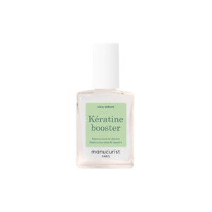 Close-up of MANUCURIST Kératine Booster Nail Strengthening Serum bottle, a keratin-rich polish designed to harden, repair, and fortify soft nails.