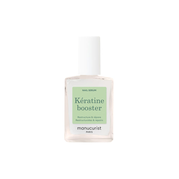 Close-up of MANUCURIST Kératine Booster Nail Strengthening Serum bottle, a keratin-rich polish designed to harden, repair, and fortify soft nails.