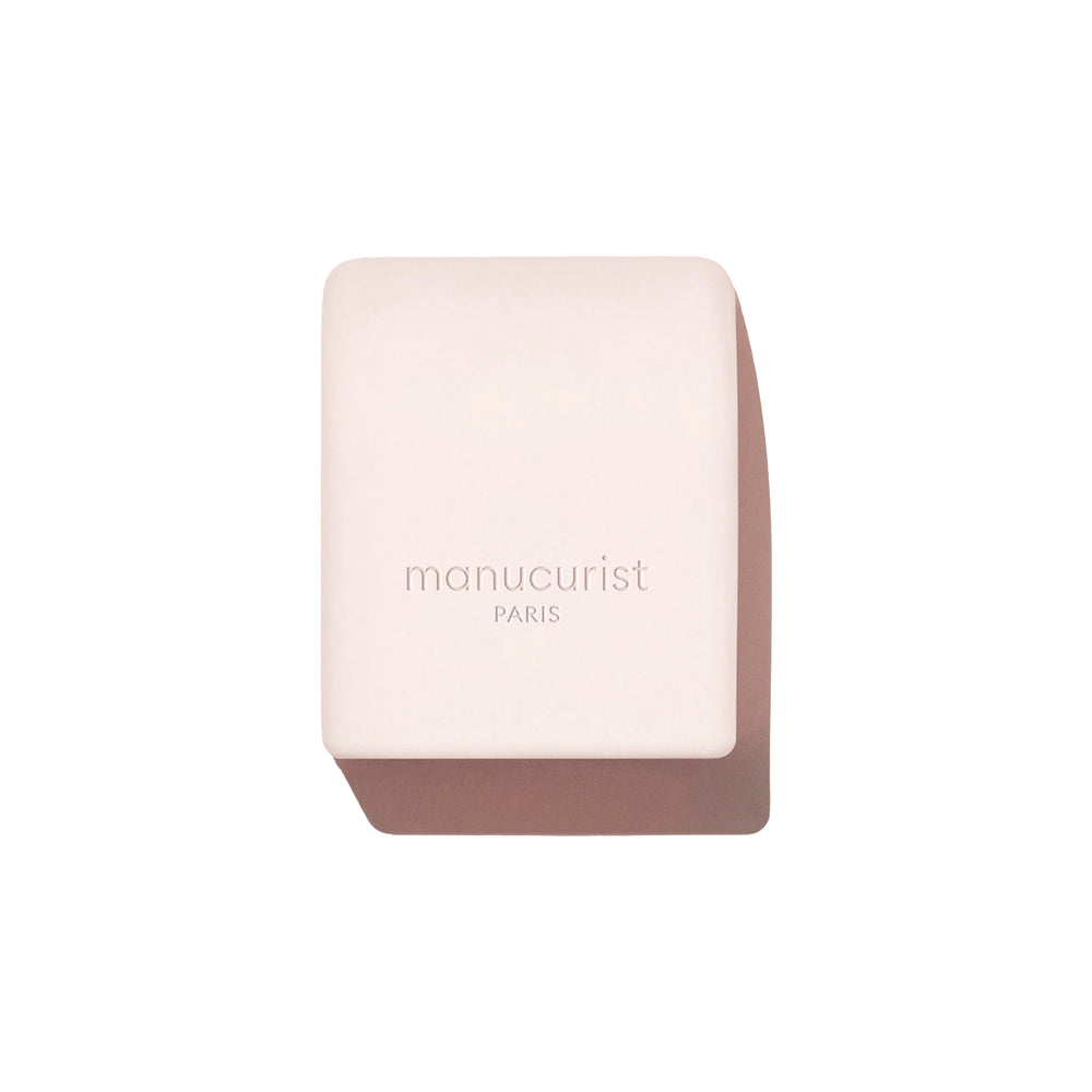MANUCURIST Mani Helper tool designed to fit nail polish bottle caps for easier, more precise application.