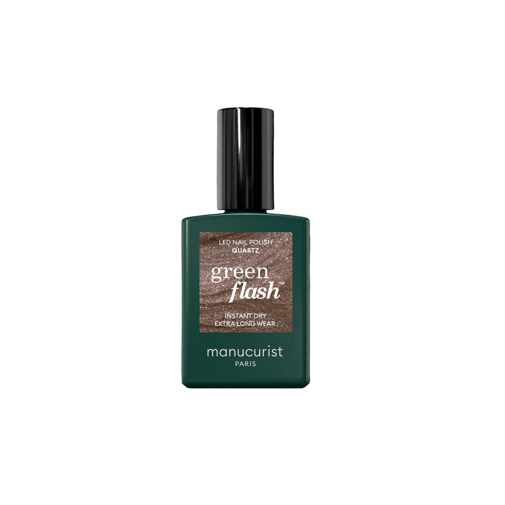 Bottle of MANUCURIST Green Flash™ Quartz semi-permanent nail polish in a glittery chestnut brown shade with taupe undertones and silver sparkle.