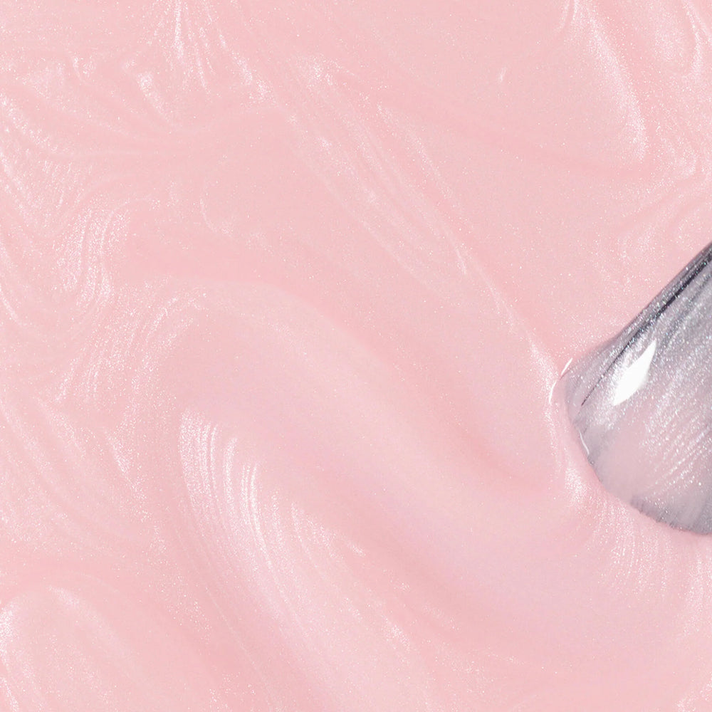 Bottle of MANUCURIST Green Flash™ Satin semi-permanent nail polish in a pale pearly pink shade with a soft, luminous finish.