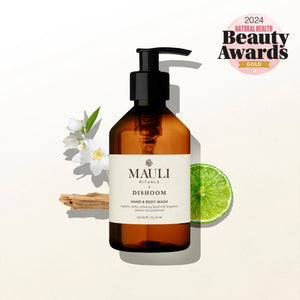 Brown bottle of Mauli Rituals Dishoom Hand & Body Wash with decorative elements on a light background