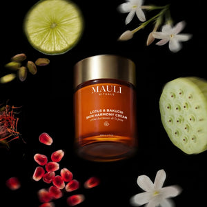 MAULI Lotus & Bakuchi Skin Harmony Cream jar with natural elements on a black background