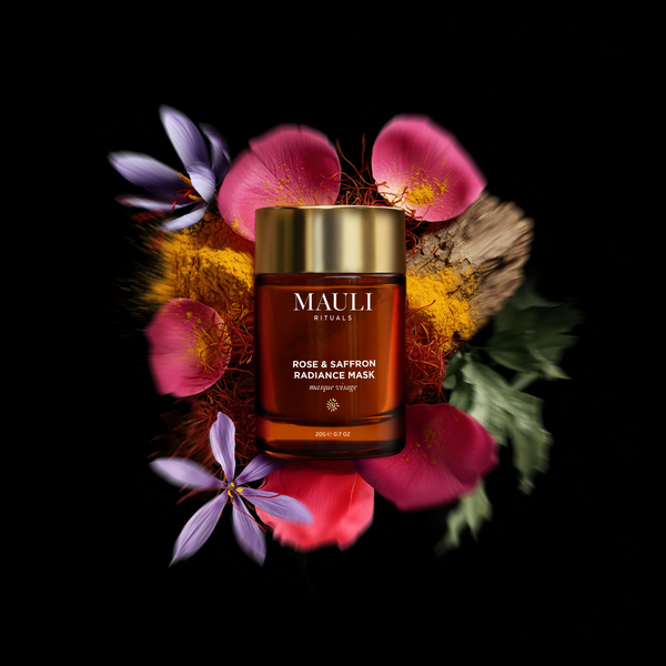 MAULI Rituals Rose & Saffron Radiance Mask jar surrounded by flowers on a black background