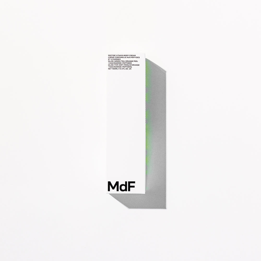 Silver tube of Peptide Vitamin Body Cream by MdF Beauty on a white background