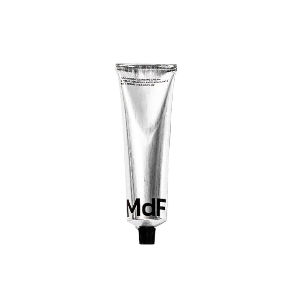 Silver tube of MDF soothing cleansing cream on a white background