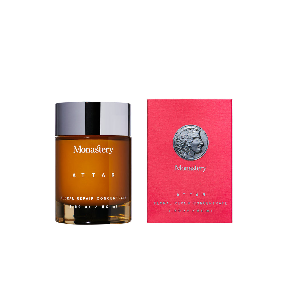 MONASTERY ATTAR Floral Concentrate in glass amber jar with silver cap next to rose box, on white background