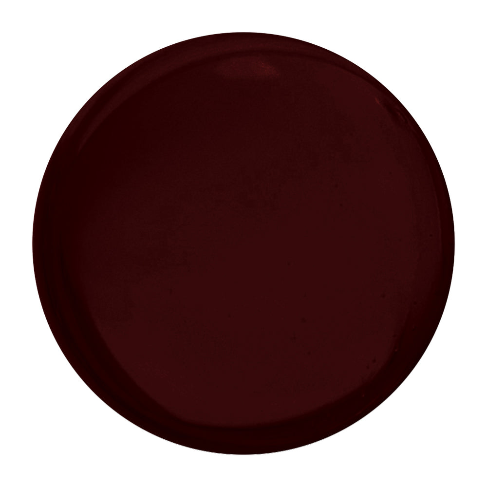 Bottle of Nailberry Kirsch Kiss dark cherry burgundy nail polish on white background.