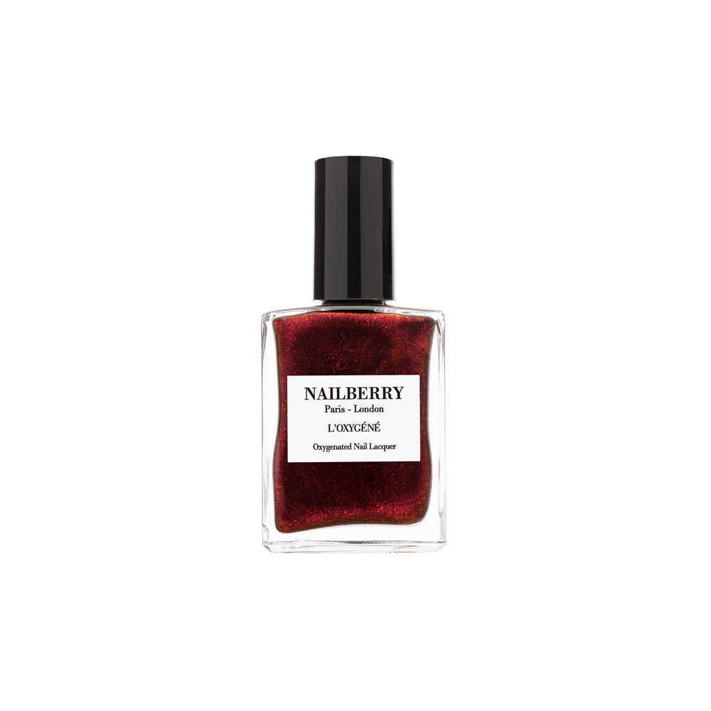 Bottle of NAILBERRY Very Merry Merlot nail polish in pearlised burgundy-black shade with shimmering, festive finish.