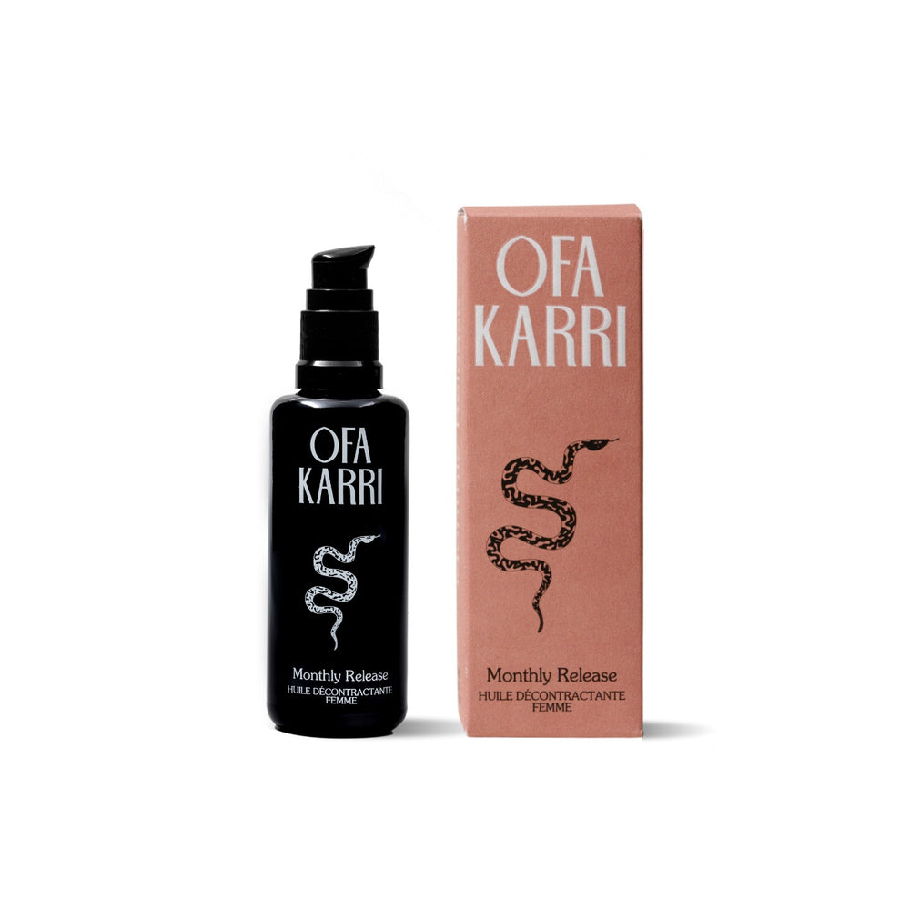 OFA KARRI Monthly Release – a natural massage oil with organic essential oils, featuring a warm, floral scent in a 50ml purple glass bottle.