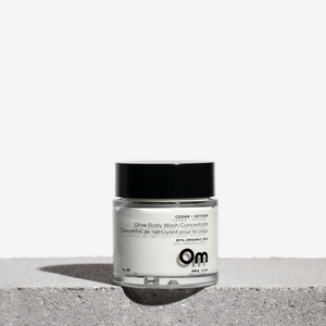 Om Organics Cedar + Vetiver Glow Body Wash Concentrate in a creamy, waterless formula with nourishing botanicals and a grounding, woodsy scent.