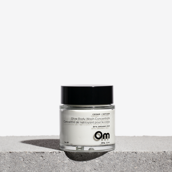 Om Organics Cedar + Vetiver Glow Body Wash Concentrate in a creamy, waterless formula with nourishing botanicals and a grounding, woodsy scent.