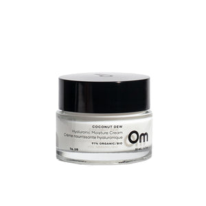 Om Organics Coconut Dew Hyaluronic Moisture Cream in a glass jar, a lightweight moisturizer for soft, hydrated skin.