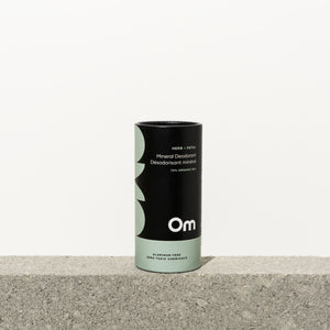 Om Organics Herb + Petal Mineral Deodorant in a biodegradable push-up tube, featuring a gentle, baking soda-free formula with a herbal and woodsy scent.