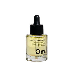 Om Organics Hibiscus + Daikon Seed Protective Hair Oil bottle, showcasing its lightweight formula for shine and softness.