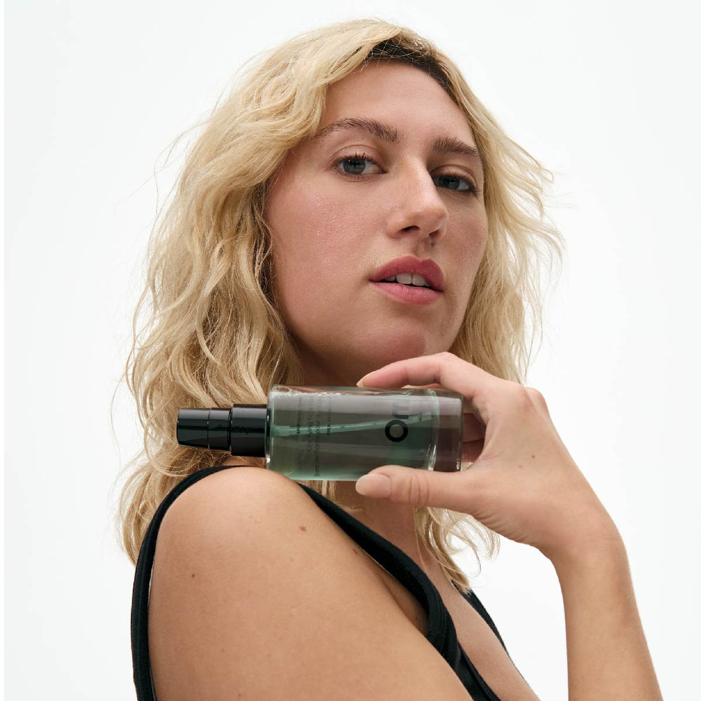 OM ORGANICS Spirulina Tonic Clarifying Face Mist bottle with a clean, minimal design, showcasing key ingredients like spirulina, sandalwood water, and rosemary water.