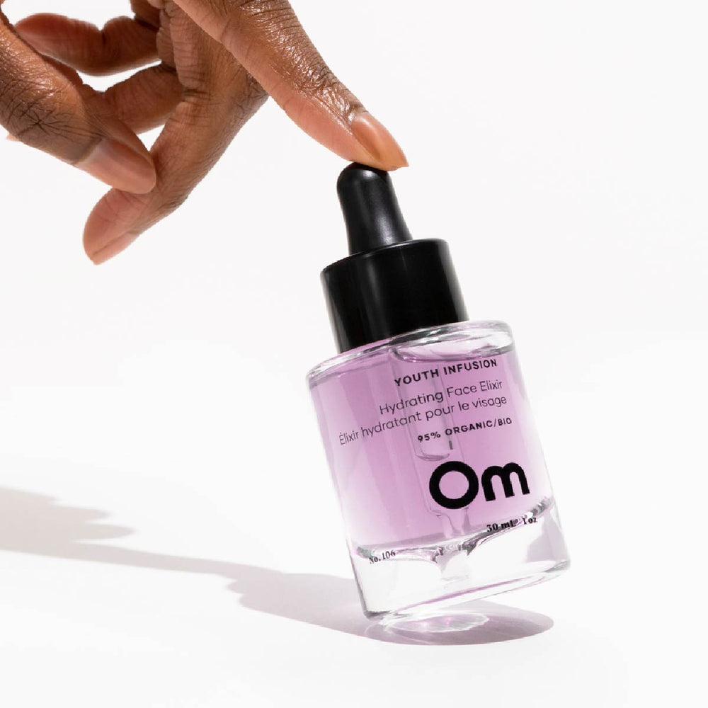 Om Organics Youth Infusion Hydrating Face Elixir - Hydrating and smoothing face serum with hyaluronic acid and bio-retinol.