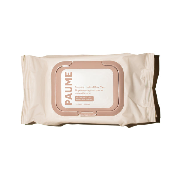PAUME Cleansing Hand and Body Wipes in a cream-colored resealable package with a dusty pink border and a white label in the center, set against a plain white background.