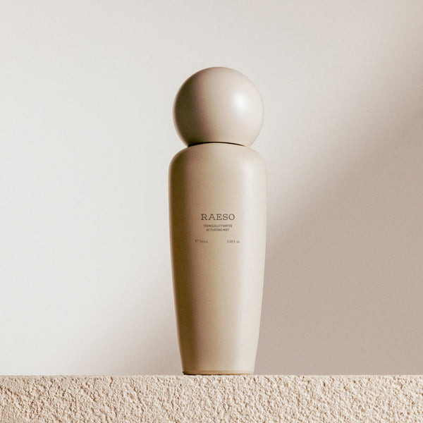 Beige bottle with 'RAESO' branding on a light beige background