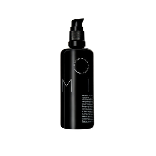 Bottle of REVERIE Milk Anti-Frizz Leave-In Nourishing Serum — a silicone-free, multi-tasking hair serum for all hair types that moisturizes, softens, and protects. full size