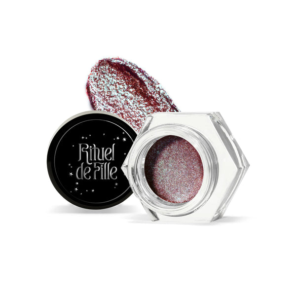 RITUEL DE FILLE Celestial Sphere Gelée Eye Gloss Cygnus, a deep red eye gloss with blue-green iridescent shimmer in a sleek compact jar.