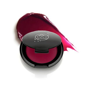 Rituel de Fille Color Nectar Pigment Balm in Glasswing, plum jelly shade in compact.