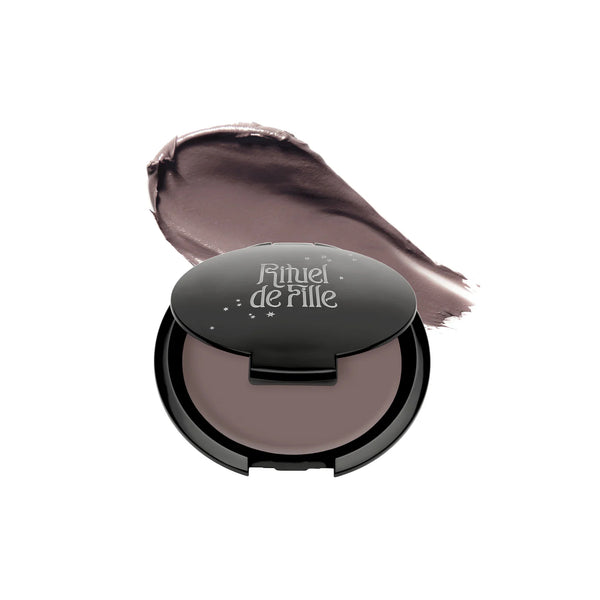 RITUEL DE FILLE Inner Glow Crème Pigment in Intuition, a soft gray taupe-mauve cream pigment housed in a starry black compact.