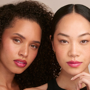 Two women with close-up faces against a neutral background. RMS BEAUTY Liplights Cream Lip Gloss Chameleon