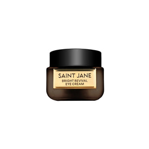 Saint Jane Bright Revival Eye Cream in a dark brown jar with a black lid and a gold label, centered on a plain white background.